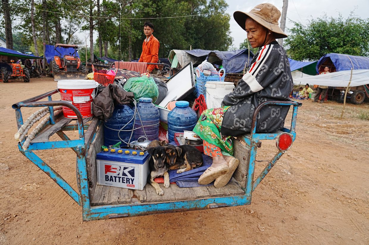 A family arriving to take refuge in Srey Snam, Siem Reap province, Cambodia on Dec 10. - AP