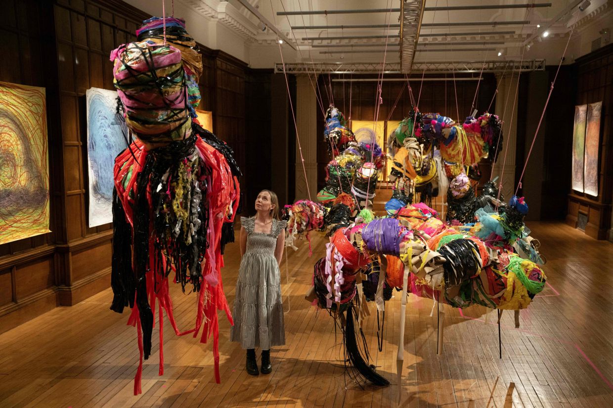 A visitor looks at an art installation 'Hanging Sculpture 1–10,' by Nnena Kalu, this year’s Turner Prize winner. Photo: AFP 