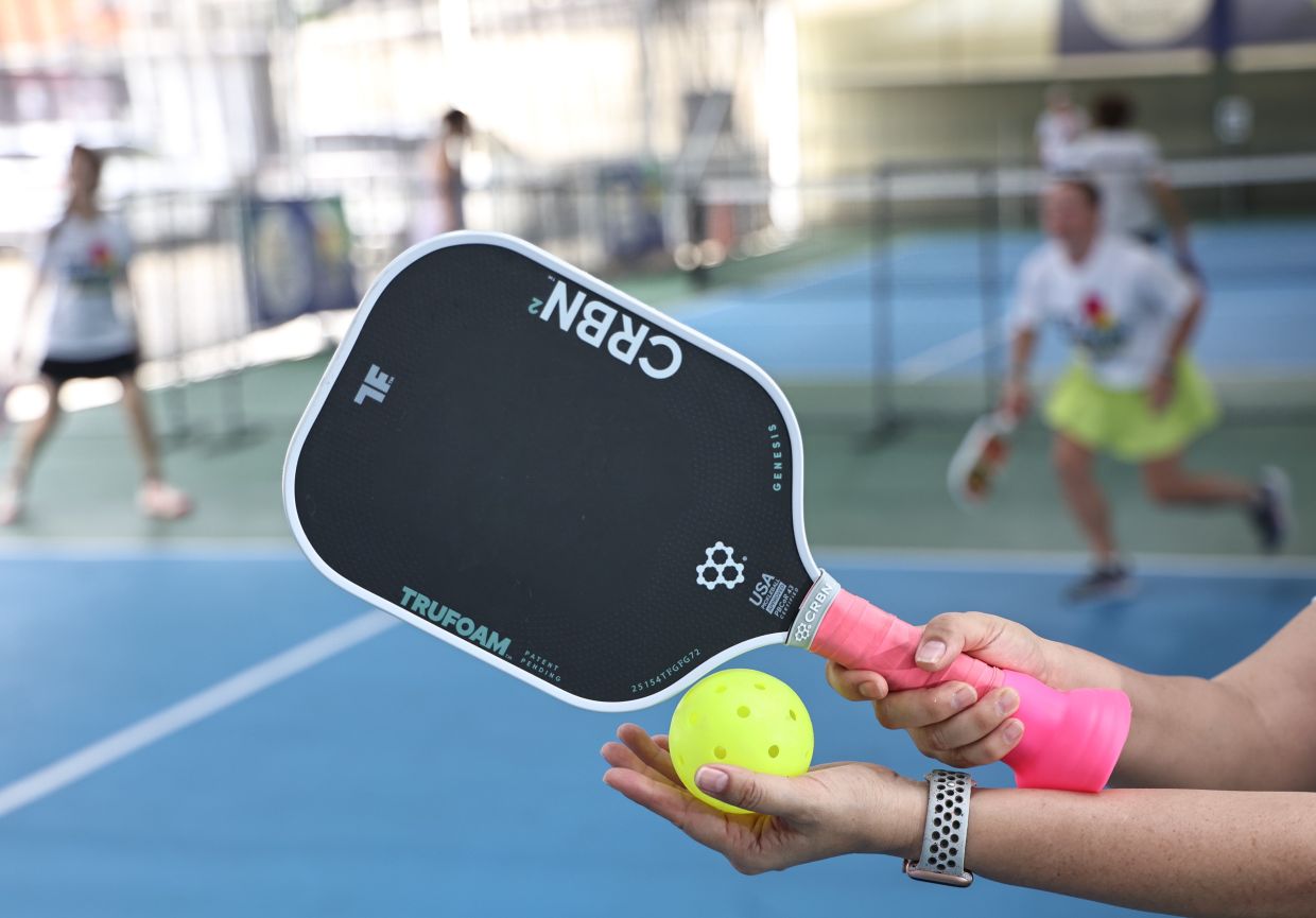 Holding your paddle at chest level helps you respond faster, especially during quick exchanges near the net.