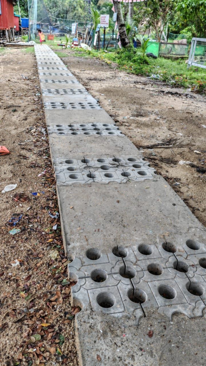 A combination of slabs and pavers created by plastic waste at kg Lobong in Pulau Gaya off Kota Kinabalu.