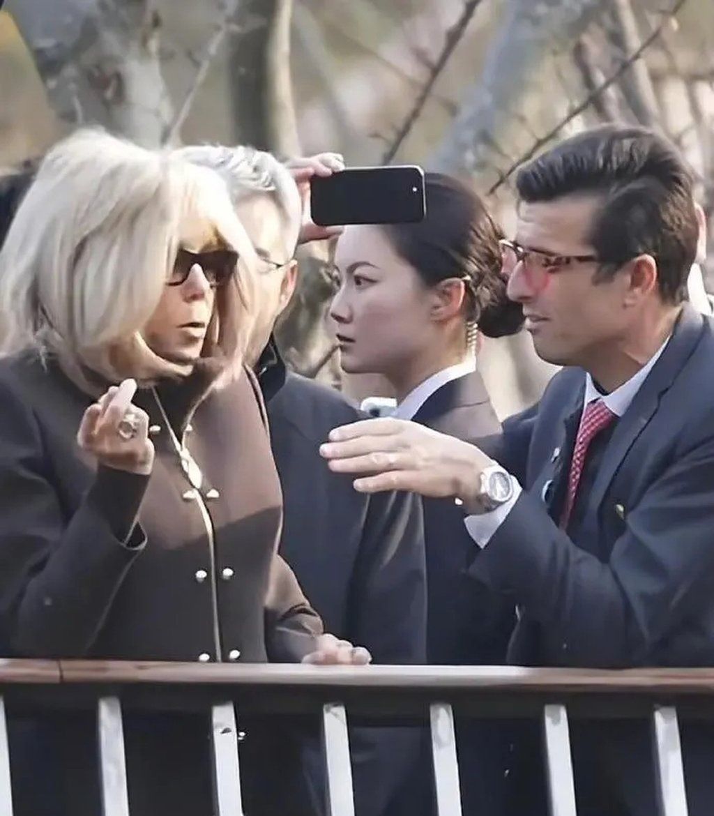 While Brigitte Macron, left, attended public events in Beijing and Chengdu, Yan, middle, was captured on film maintaining an alert demeanour, her eyes continually scanning the surroundings for potential threats. - Photo: Weibo