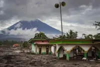 Indonesia’s Semeru volcano erupts, dozens of homes buried by rain lahar, hundreds flee to hills