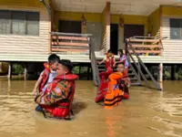 Firefighters save eight from rising floodwaters at a school in Bintulu