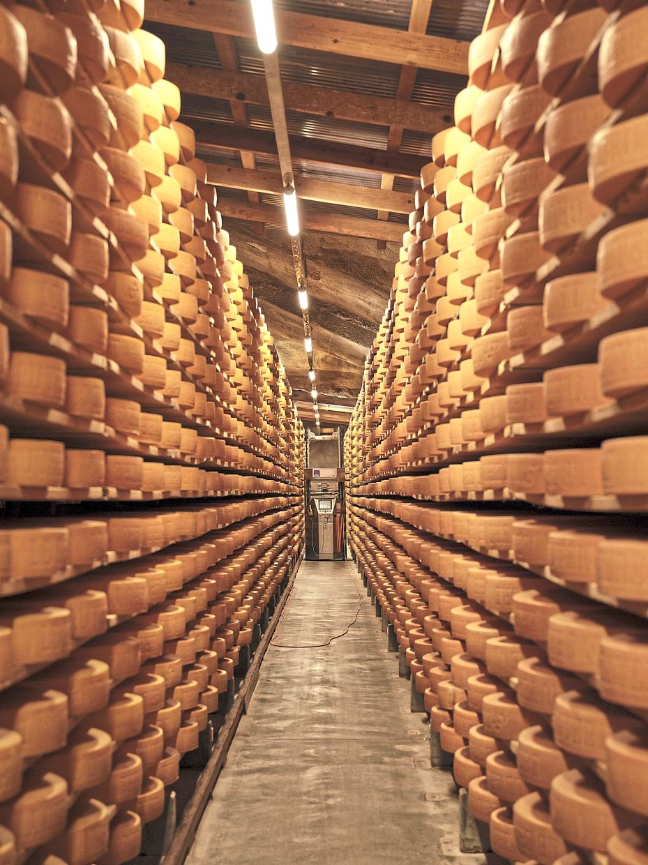 A robot turning and washing Gruyére in brine in one of Margot Fromages’ cheese cellars in Yverdons-les-Bains. — Lea Meienberg/The New York Times