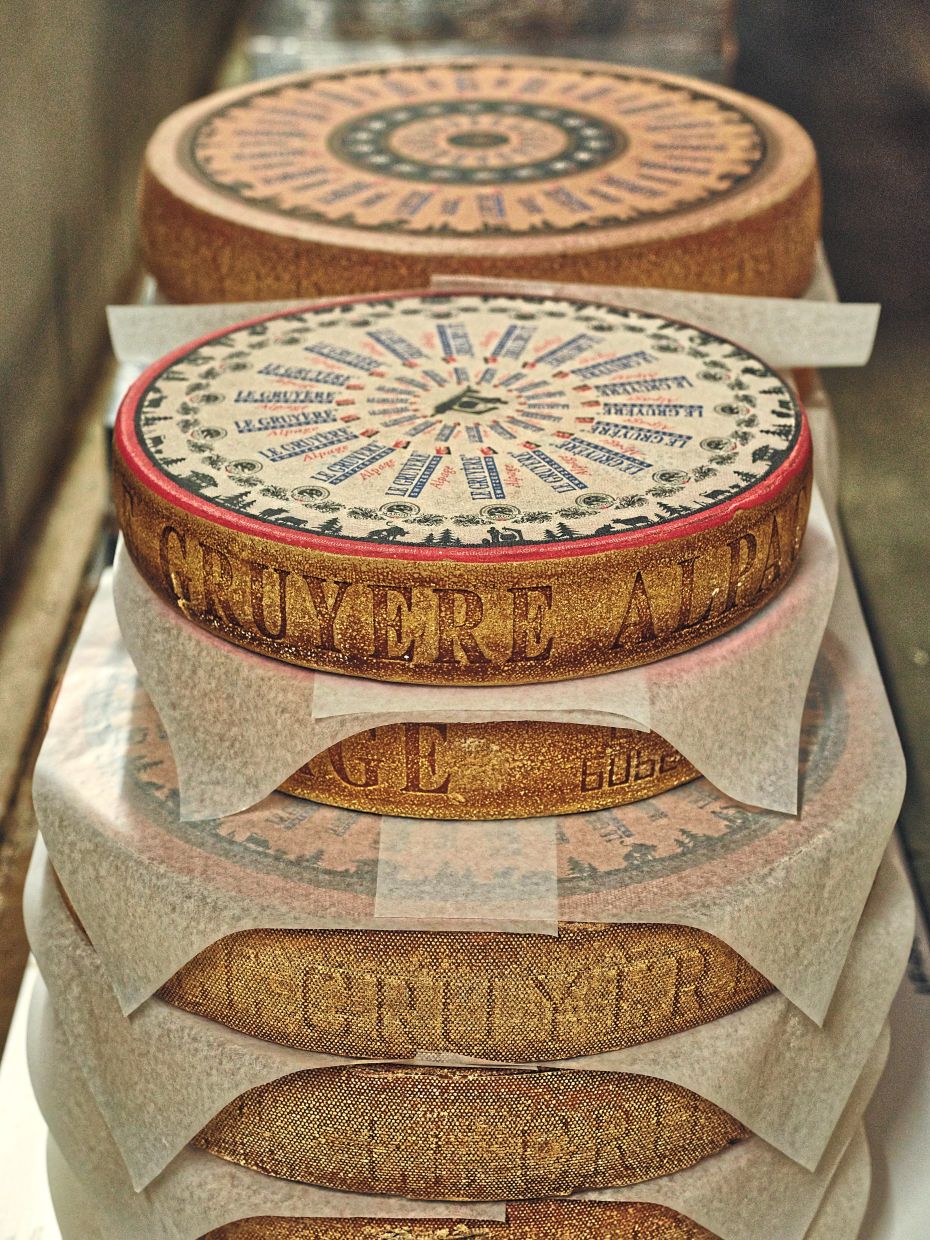 A few of the approximately 36,000 wheels of Gruyére resting in the cheese cellars at Margot Fromages in Yverdons-les-Bains, Switzerland. — Lea Meienberg/The New York Times