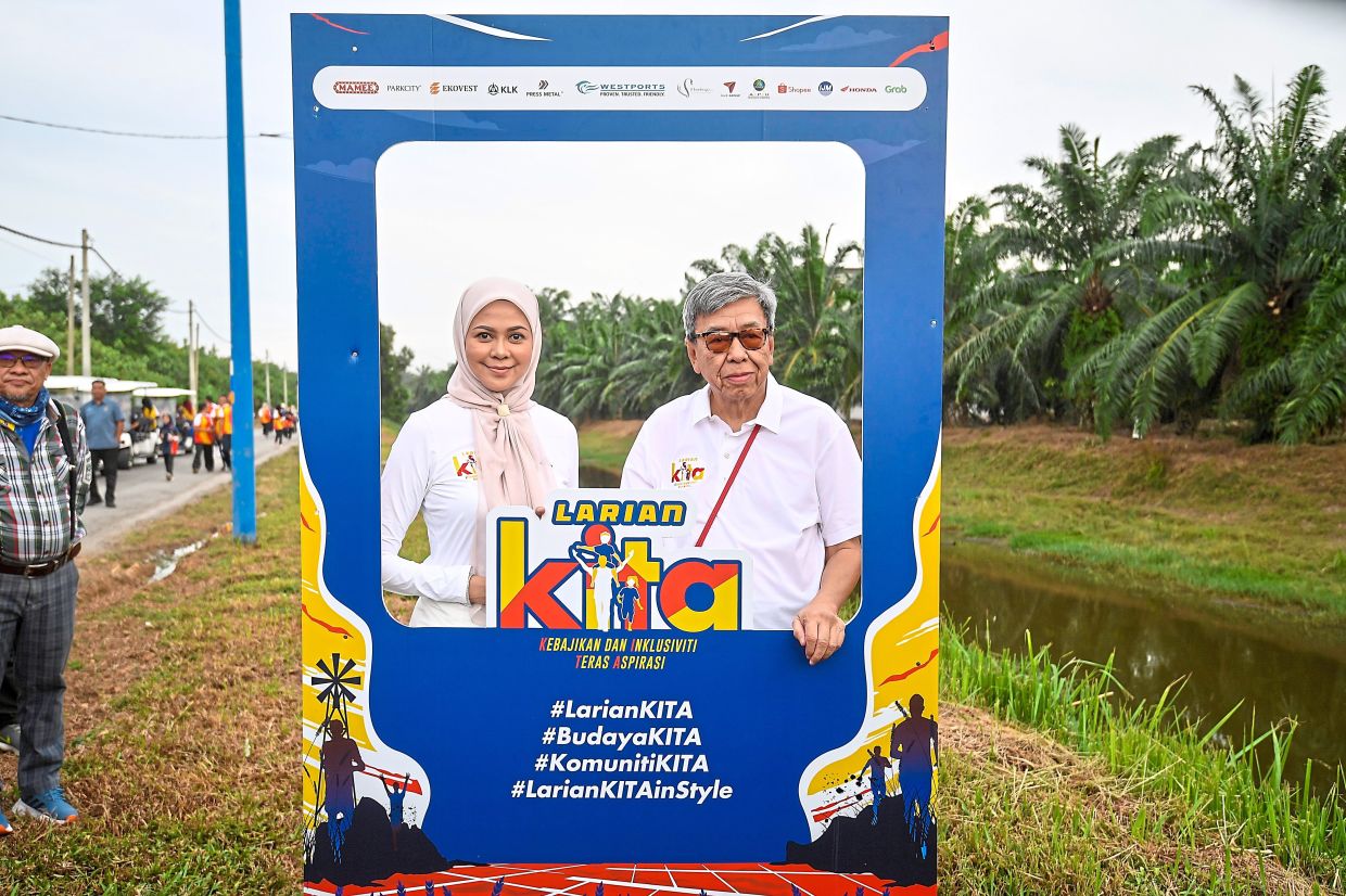 The royal couple posing for a snapshot at the Larian KITA X Pesta Kelaut @ Pantai Kelanang 2025 photo booth in Banting in July. — IZZRAFIQ ALIAS/The Star