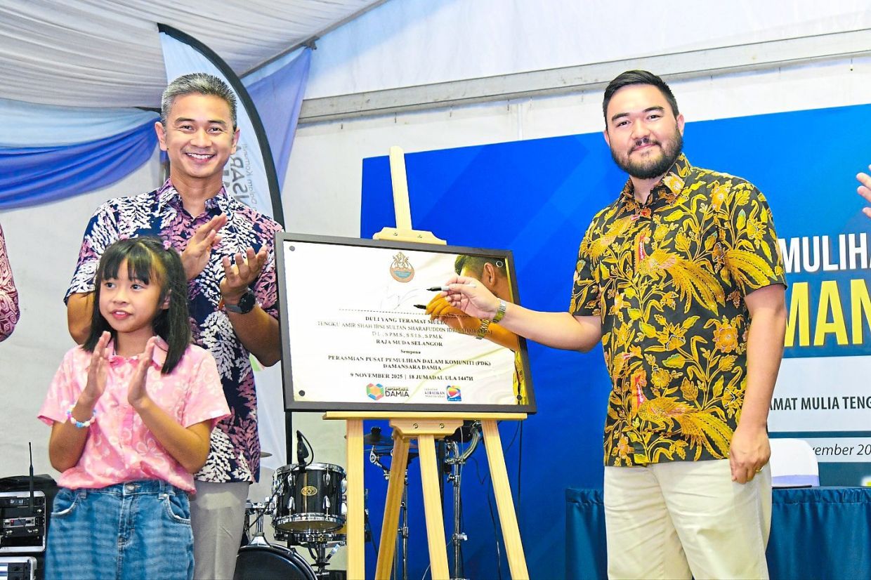 Tengku Amir Shah inaugurating the PDK Damansara Damia last month, opening a new chapter of autism support for B40 families. With him are founder Izhar and his daughter Daniella Damia. — Photo from Selangor Royal Office Facebook page