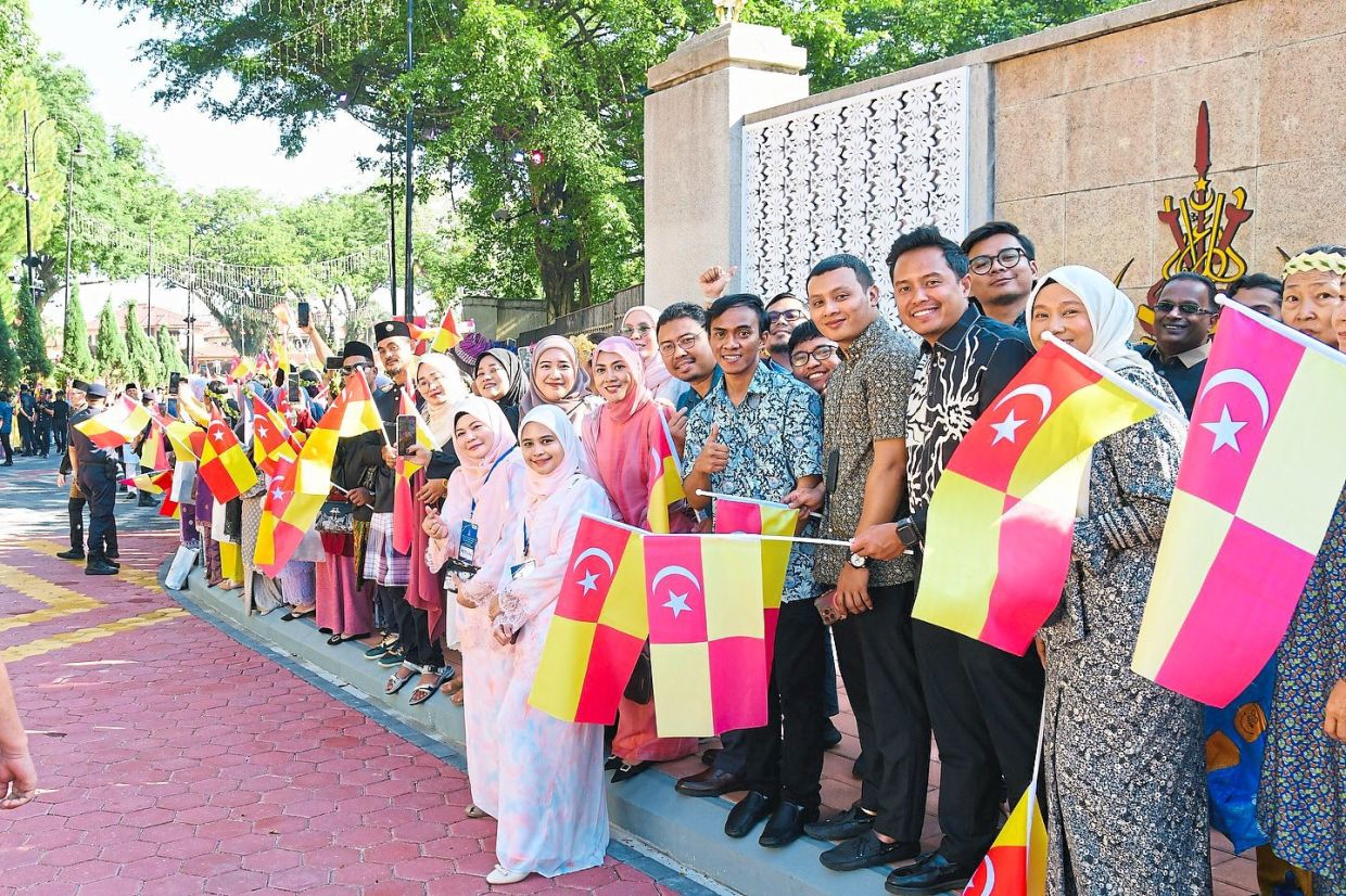 People from across Selangor gathered along the streets to congratulate the newlyweds.