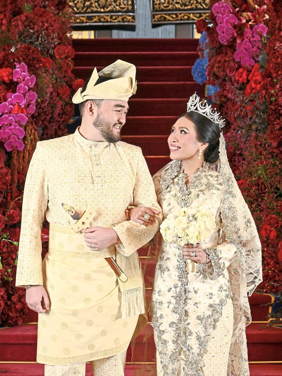 Tengku Amir Shah and Afzaa Fadini sharing a moment during their wedding ceremony at Istana Alam Shah.