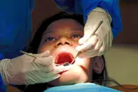 Adult smiles shine, child dental health falters