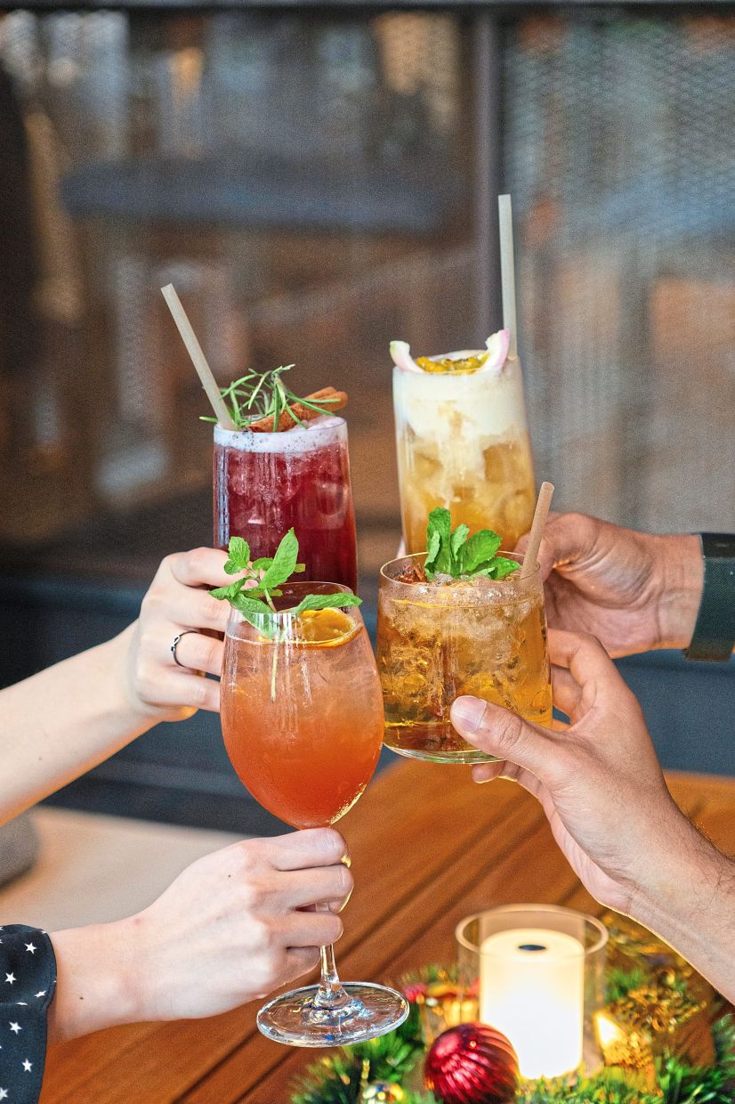 (Clockwise from top left) Spiced Sangria, Tropical Santa-tea, Christmas Julep, Jingle Berry Spritz from @21 Rooftop Bar.