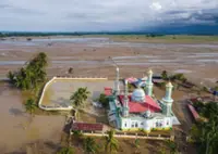 Nowhere to pray as logs choke flood-hit Indonesian mosque