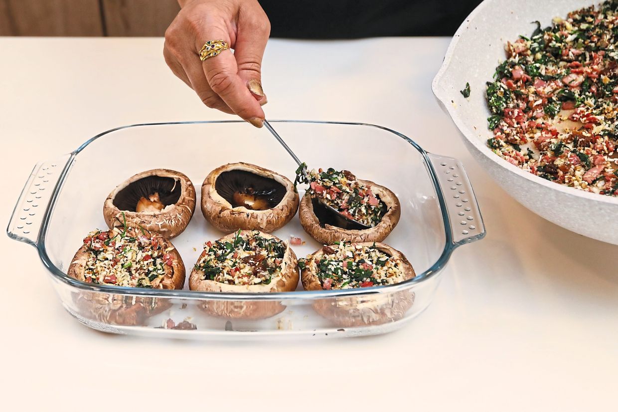 Fill the portobello mushroom caps with the stuffing.