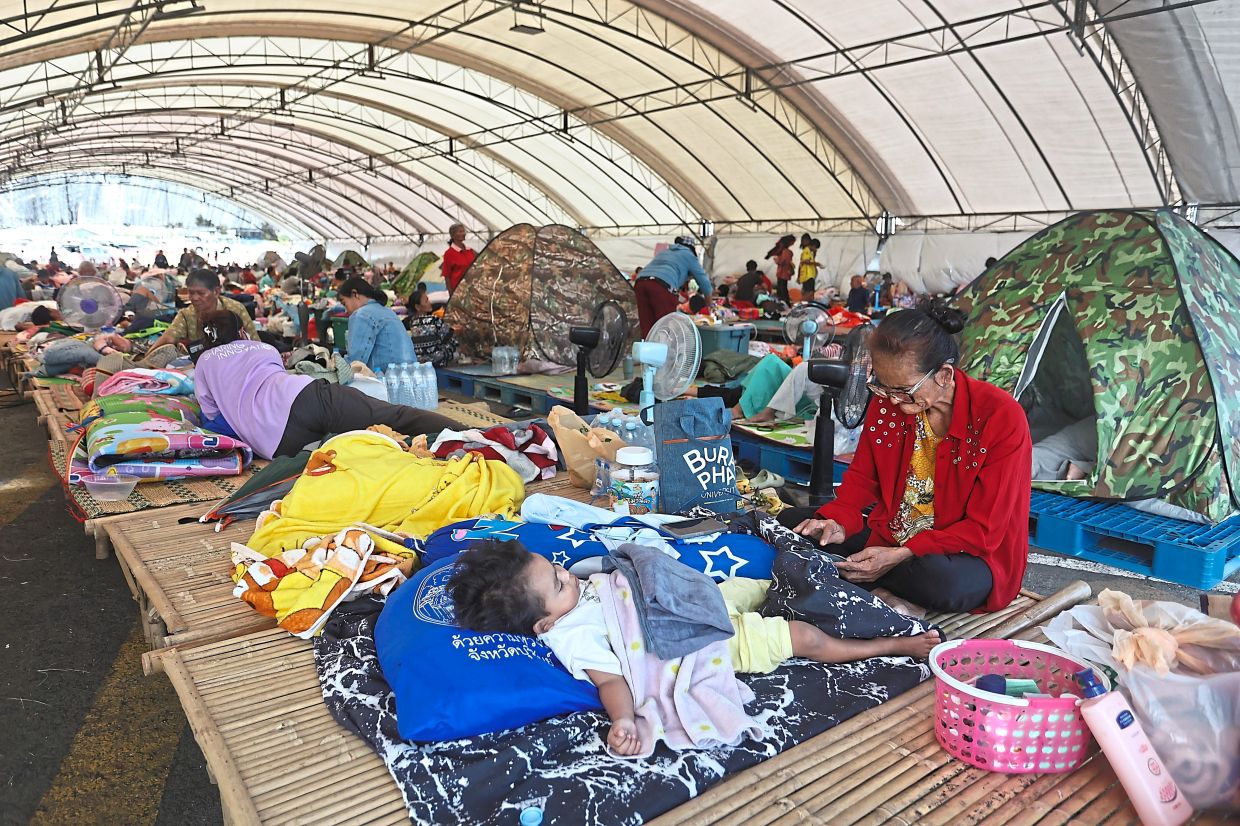 Thai evacuees resting at an evacuation centre in Buriram province, Thailand. — AP