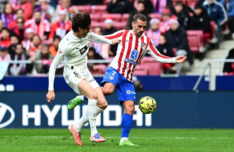 Soccer-Atletico substitute Griezmann secures 2-1 win over Valencia