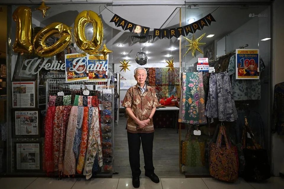 Mr Ang Kum Siong at the entrance of Wellie Batik at Holland Road Shopping Centre on Dec 13. He has been operating out of the mall since starting his business in 1978. - ST