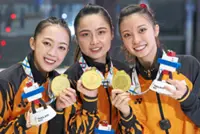 Mandy-Sydney-Loh strike gold after gruelling training grind