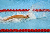 Khiew races to defend 200m freestyle title  