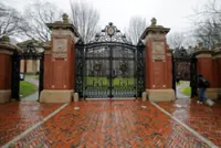 Suspect at large in Brown University shooting that killed at least two, injured eight