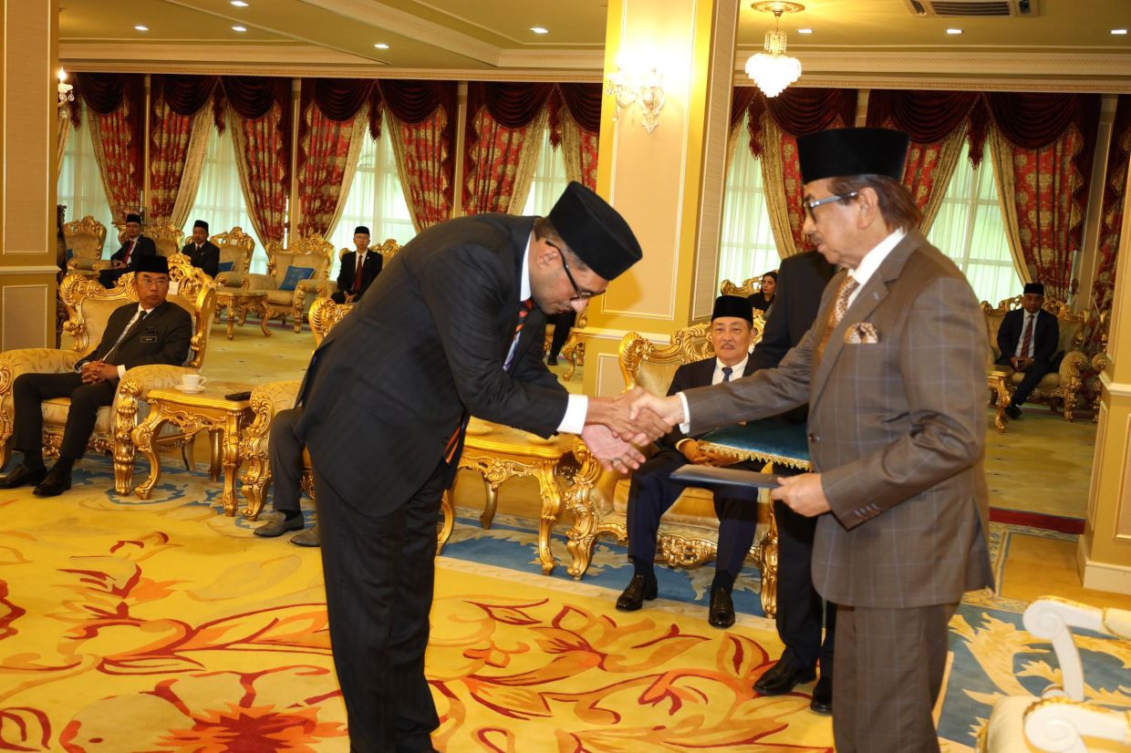 Anil (left) thanking Musa after the appointment.