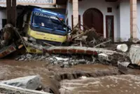 Indonesia president expects flood-stricken Sumatra to return to normal in 2-3 months as death toll exceeds 1,000