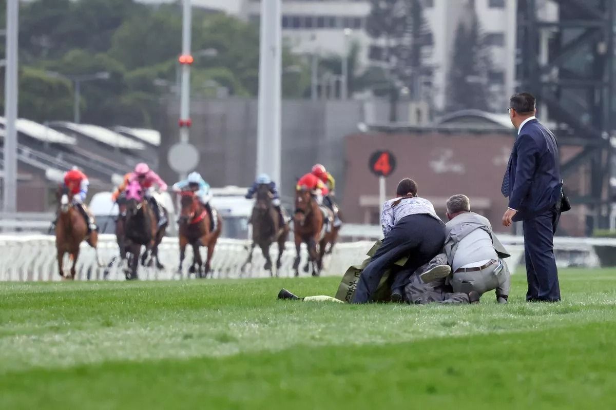 Man bailed for fire protest on track at Hong Kong's richest horse race