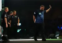 Darts-Menzies apologises for punching table at World Championship