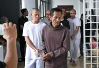 Man claims trial to slashing surau caretaker