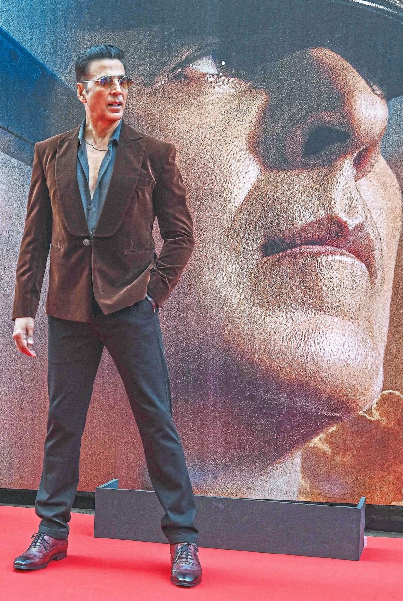 Kumar posing for photos during an event for the promotion of his war film ‘Sky Force’ in Mumbai. — AFP