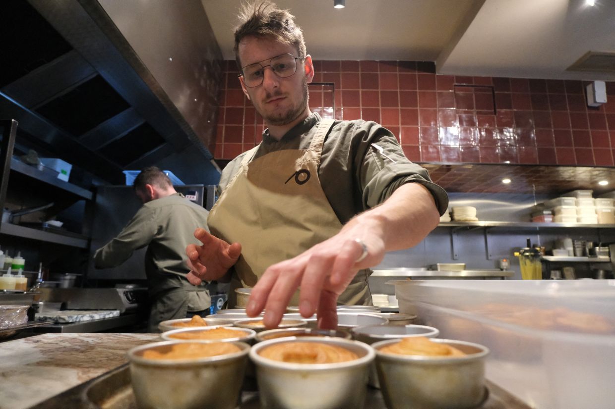 A chef prepares a vegan dish at Plates restaurant in London, Britain, November 21, 2025. — Photos: REUTERS/Sam Tabahriti