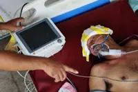 From hospital beds, Cambodian soldiers describe 'toxic gas'