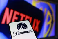 Factbox-By the numbers: How the Netflix and Paramount bids for Warner Bros stack up