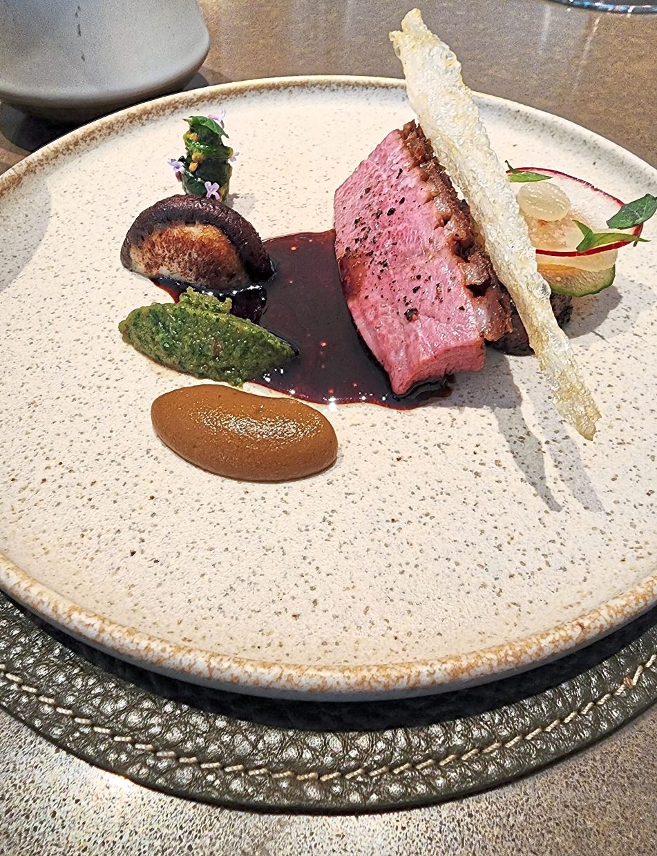 The duck percik highlights the natural beauty of duck from Bidor, Perak, juxtaposed against a percik sauce.