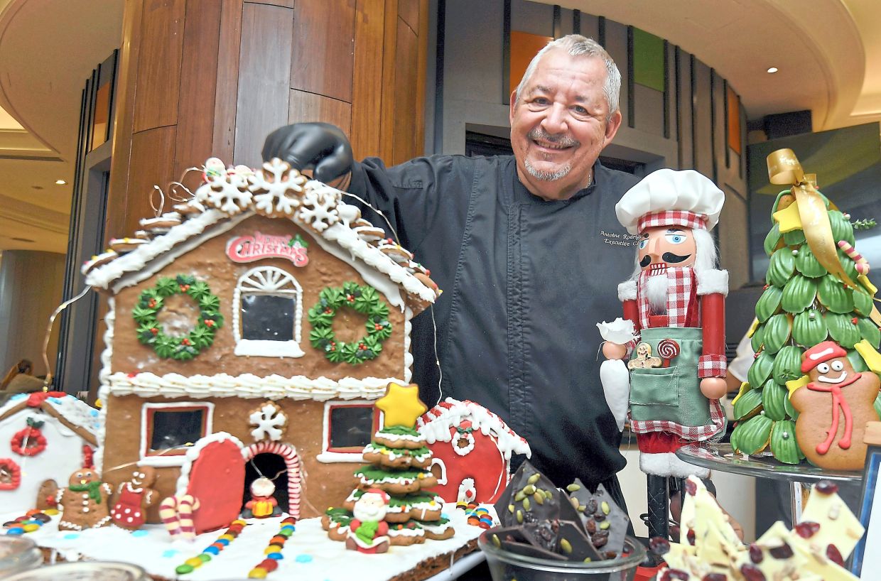 Rodriguez with traditional Christmas desserts served at the buffet.