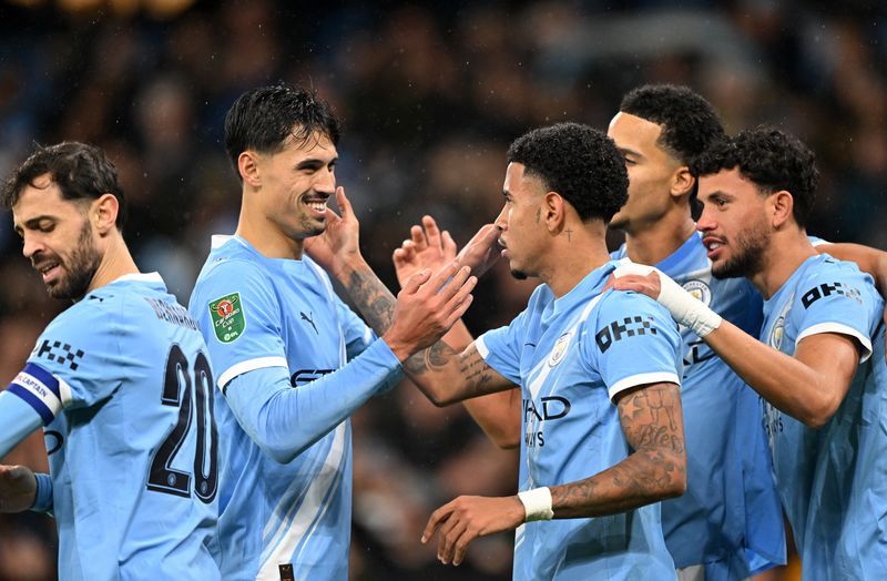 Soccer-Man City ease past Brentford to reach League Cup semi-finals