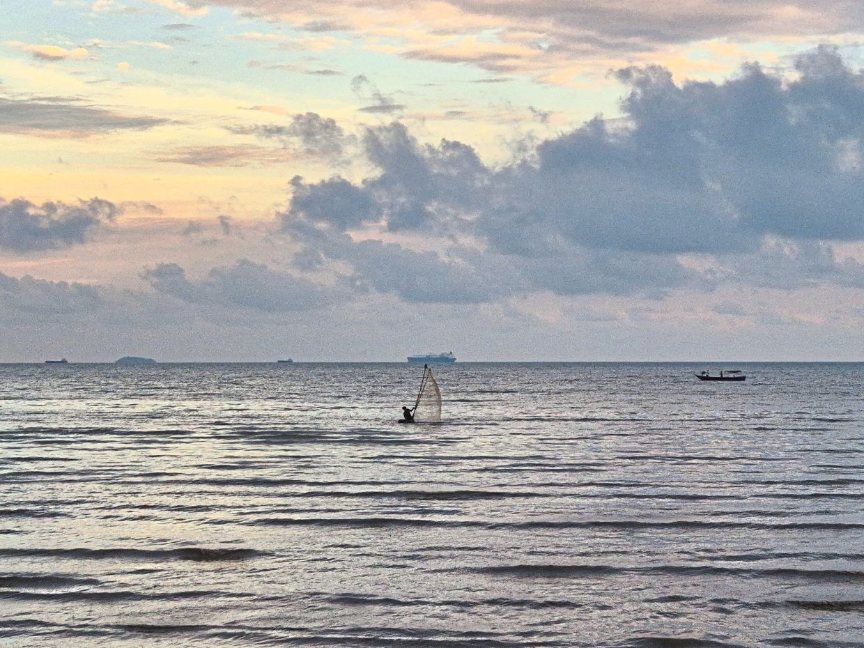 DeSilva searches for geragau along the seashore, a practice tied to the Settlement’s fishing heritage. Photo: Sabine Ferrao
