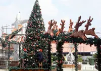 Father and son fisherman team helps deck Melaka's Portuguese Settlement for Christmas