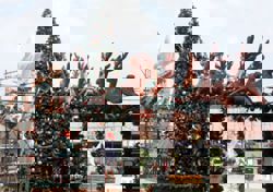 Father and son fisherman team helps deck Melaka's Portuguese Settlement for Christmas