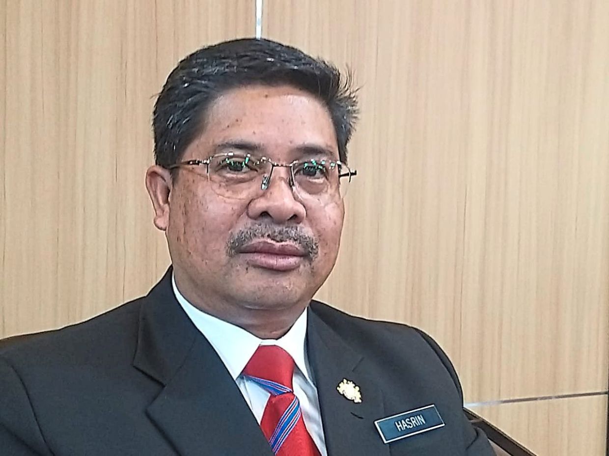 Hasrin Kamal says the parking area is designated as a no-business activity zone.