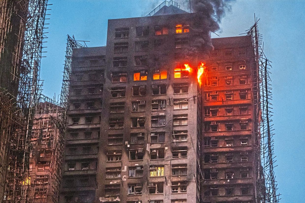 An inferno: Smoke rising as flames engulf bamboo scaffolding across multiple buildings at Wang Fuk Court housing estate. — Reuters 