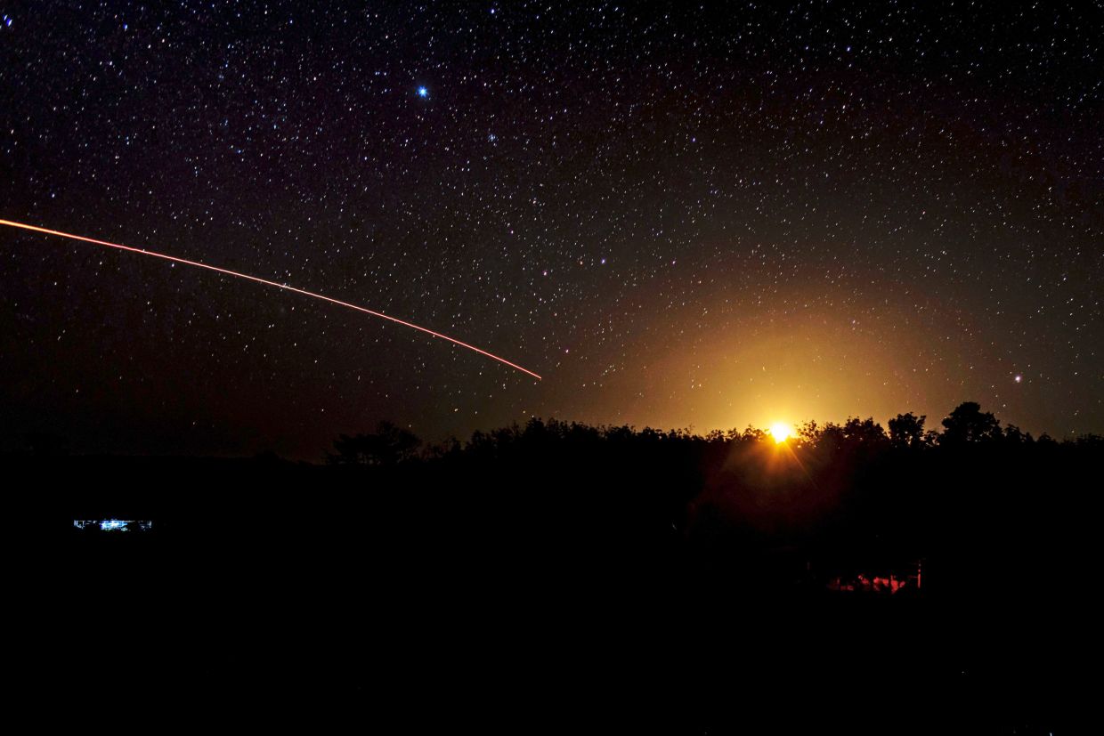 The Thai military fires artillery towards Cambodia, Tuesday, Dec. 16, 2025, in Surin province, Thailand. (AP Photo/Wason Wanichakorn)