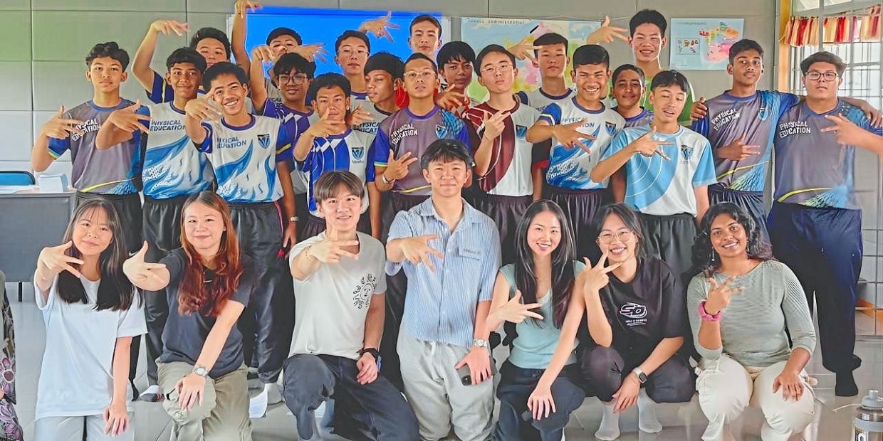 Wei Lun (front, third from left) posing with students and volunteers after the Step2Success flagship programme held at Victoria Institution in Kuala Lumpur. — Photo courtesy of KITS Malaysia’s Instagram