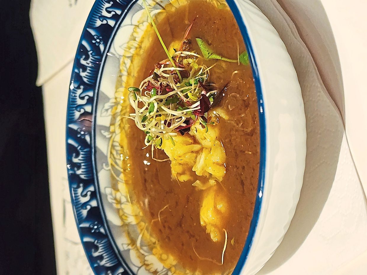 The lemongrass- infused lobster thambun hadi is a coastal dish that Sudheera says was traditionally made when people were feeling ill, but is now a rarity. — ABIRAMI DURAI/The Star 