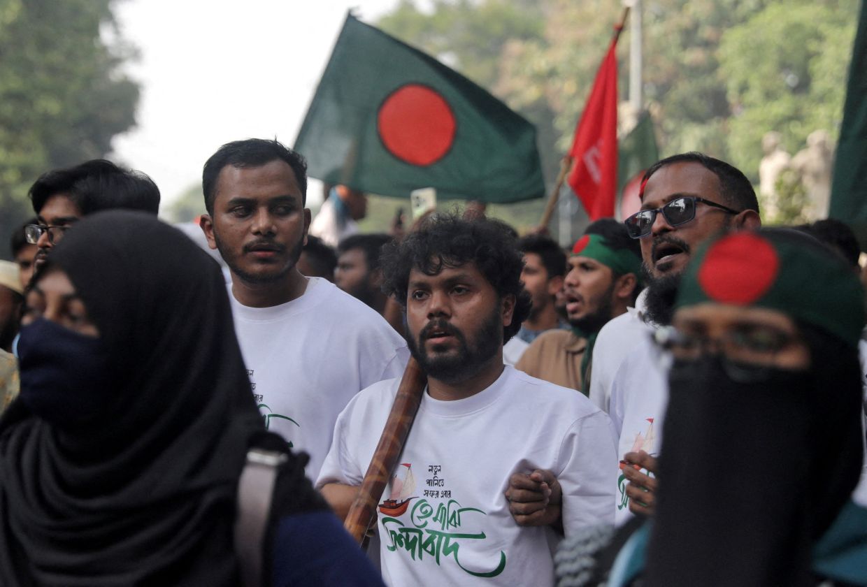 Sharif Osman Hadi (centre), a key figure in last year's uprising, was shot in Dhaka on Dec 12 and airlifted to Singapore where he succumbed to his wounds. - Reuters