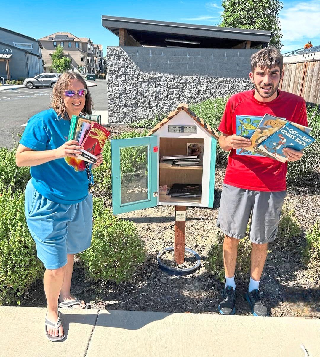 Residents browse and choose books at Irby Ranch’s Little Free Library.