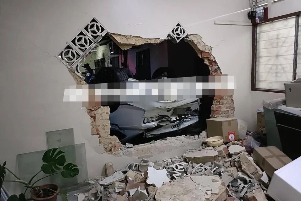 Singapore-registered car crashes into several houses in JB; driver taken to hospital