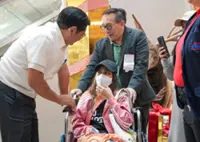 Philippines’ Marcos lauds helper returning home after deadly Hong Kong fire