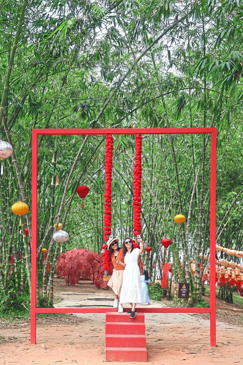 Tourists taking wefies at one of the installations in Putuo Village. — THOMAS YONG/The Star