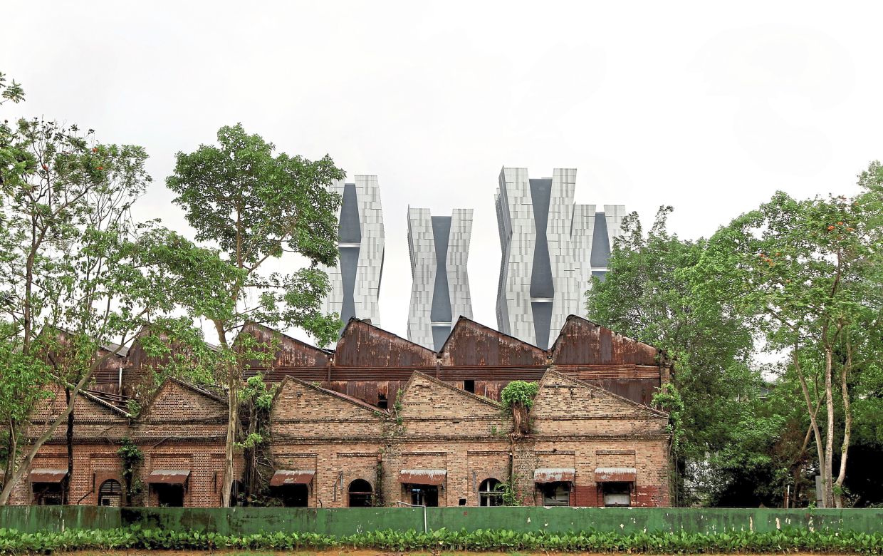 Old and new: The Fennel, a condominium with its unique asymmetric design, towering behind Sentul Depot, a railway workshop built in the early 1900s. — Filepic