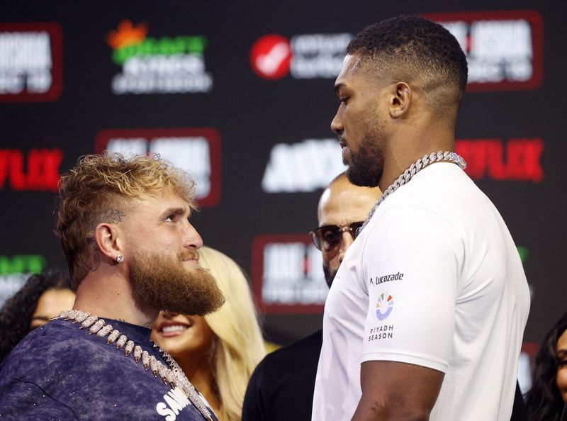 Boxing-Joshua delivers reality check to Paul with sixth-round KO